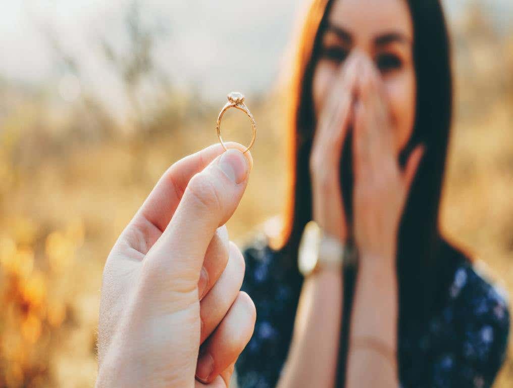 Person popping the question to girlfriend