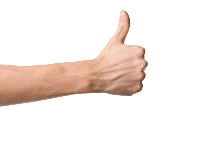 A man showing a thumbs up sign