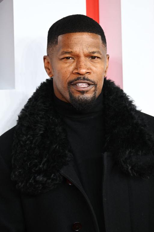 Jamie Foxx attends the "Creed III" European Premiere wearing a black turtleneck and black furry jacket.