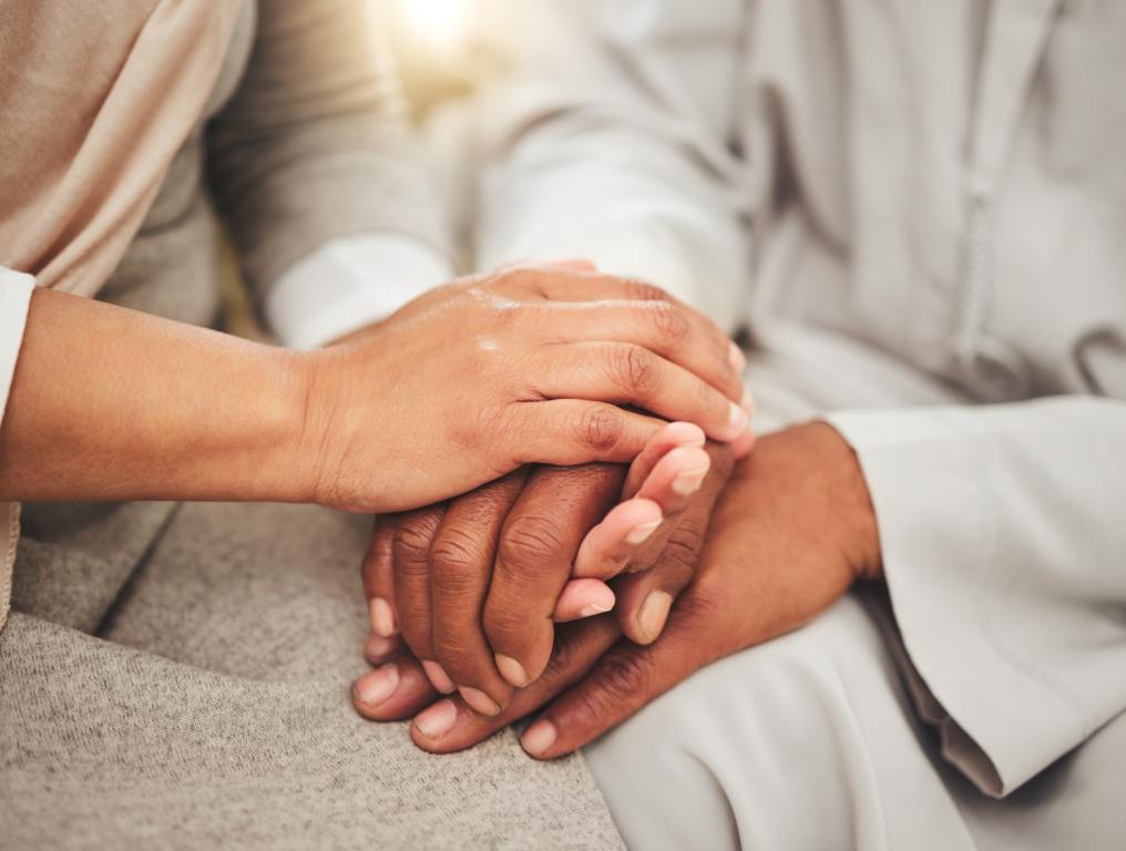 Two people holding hands