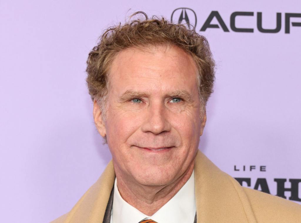 Will Ferrell attends the "Will & Harper" Premiere during the 2024 Sundance Film Festival smiling looking right wearing a khaki coat and white button up.