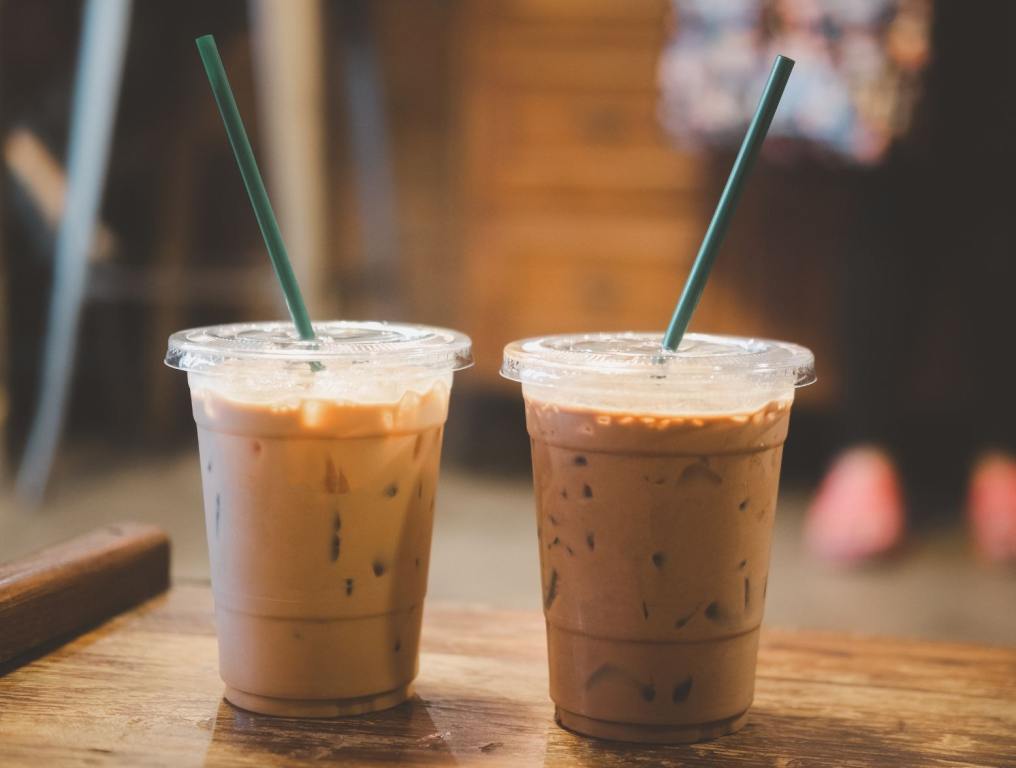 Iced coffee with a blurred background that looks like a café