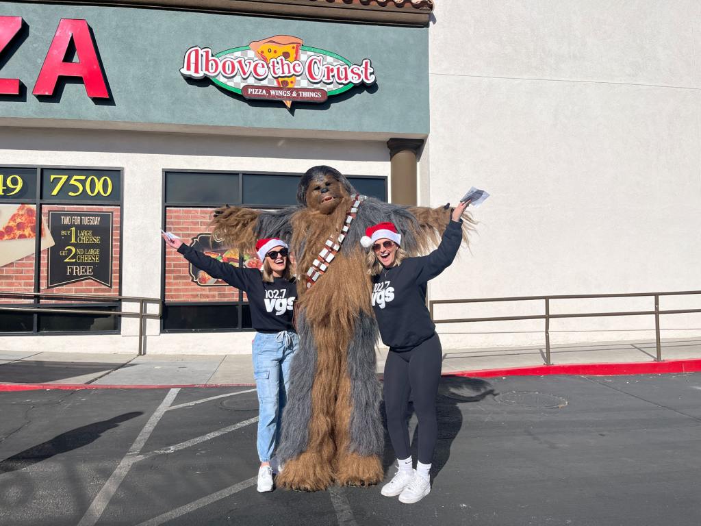 Sammi (left) stands next to Star Wars' Chewbacca (middle) and Aimee (right).