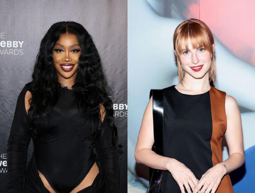 SZA wearing a black dress and Hayley Williams wearing a black and brown dress on a red carpet