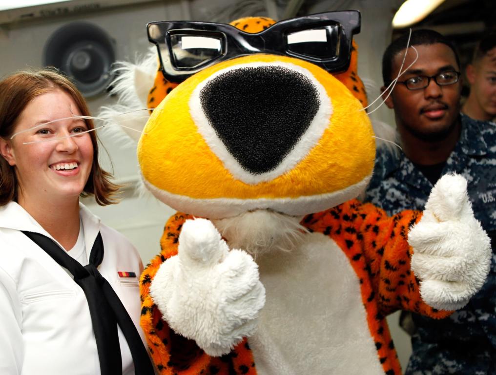 Chester Cheetah posing with couple