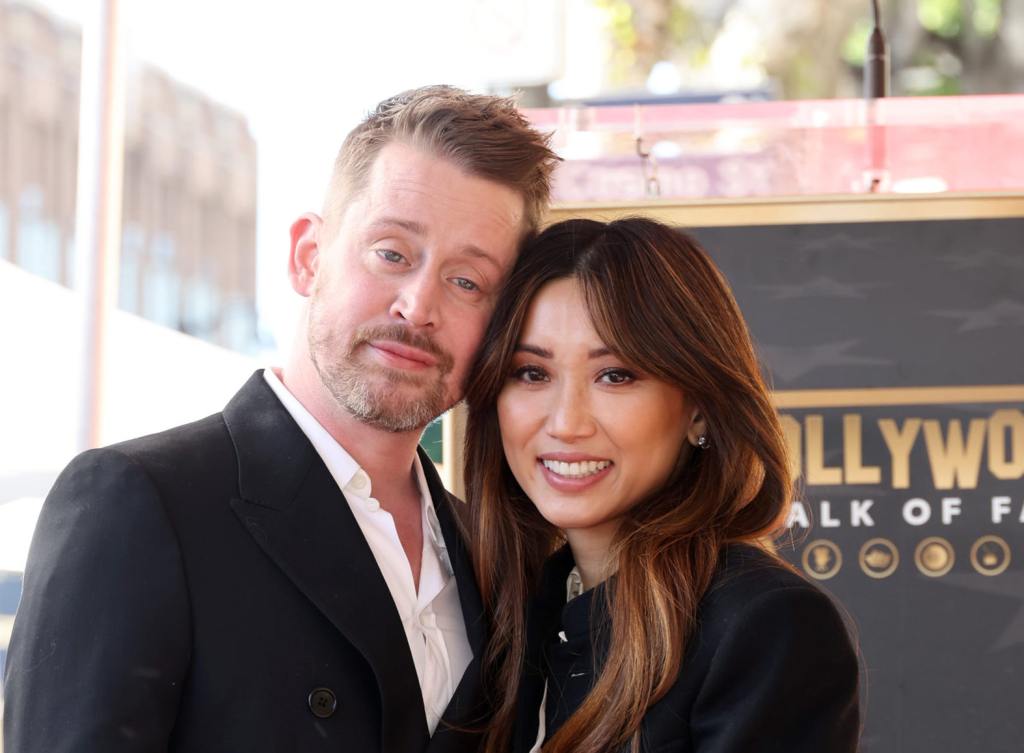 Macaulay Culkin and Brenda Song attend the ceremony honoring Macaulay Culkin with a Star on the Hollywood Walk of Fame smiling wearing a black, Brenda Song Shares Rare Insight Into Family Life With Macaulay Culkin.