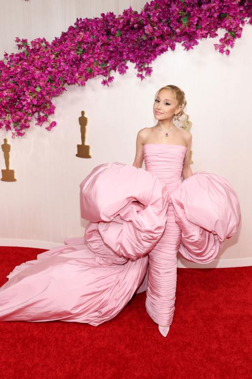 Ariana Grande attends the 96th Annual Academy Awards wearing a baby pink strapless gown.