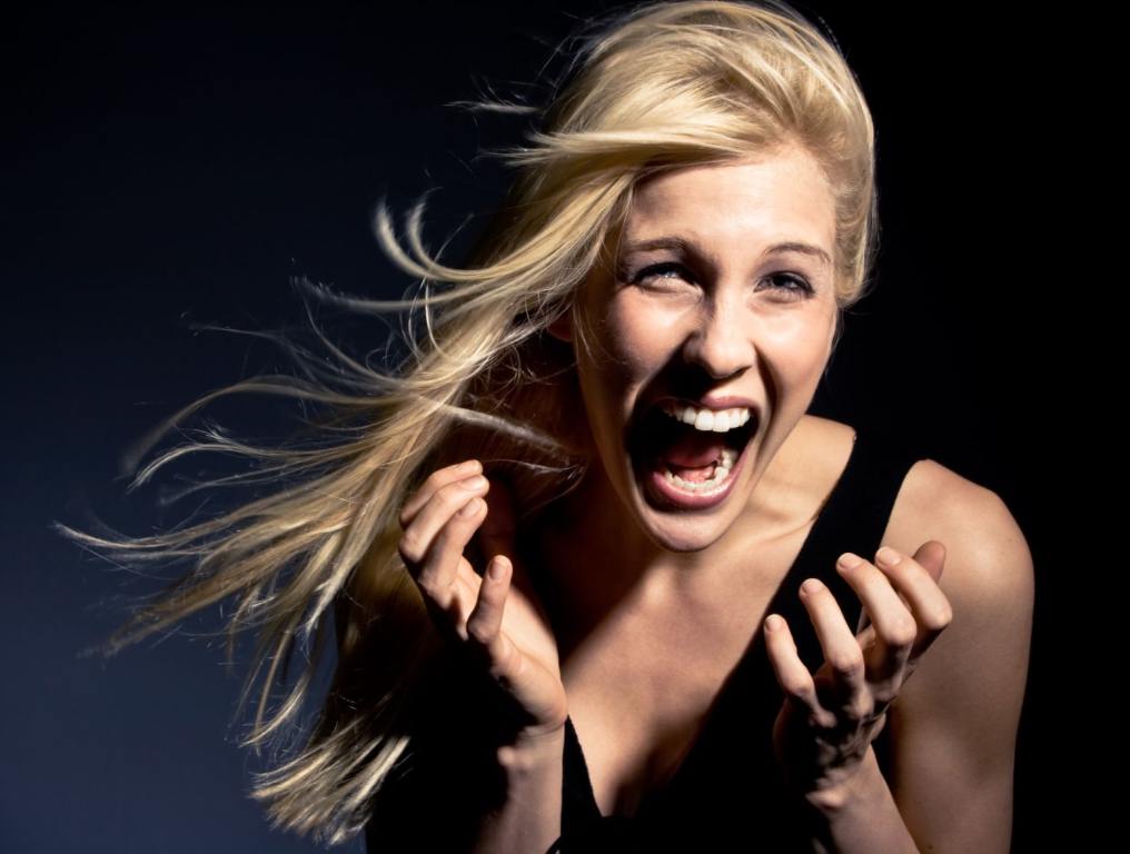 A blonde woman screaming.