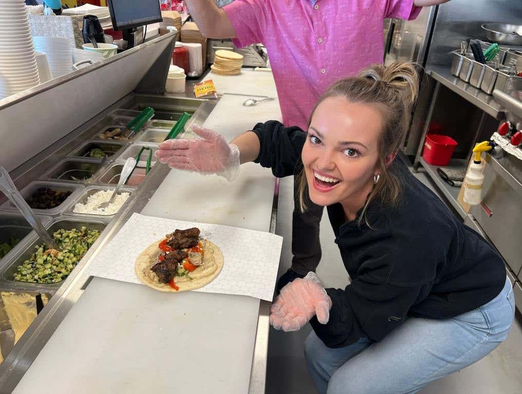 Sammi poses with pita at crazy pita