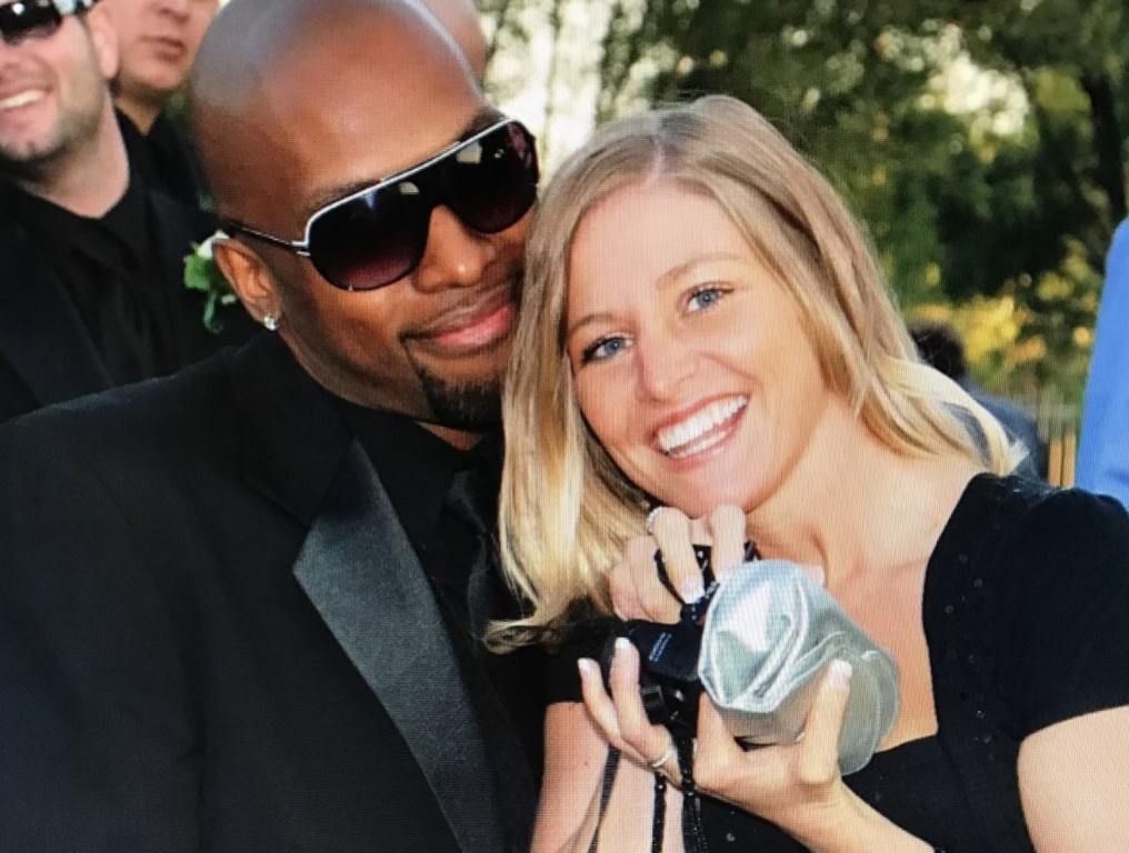 Aimee and husband all dressed up at a wedding type of event.