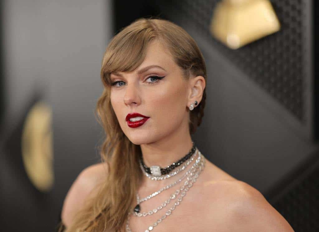 Taylor Swift attends the 66th GRAMMY Awards wearing a white strapless gown, Taylor Swift Is Officially A Billionaire.