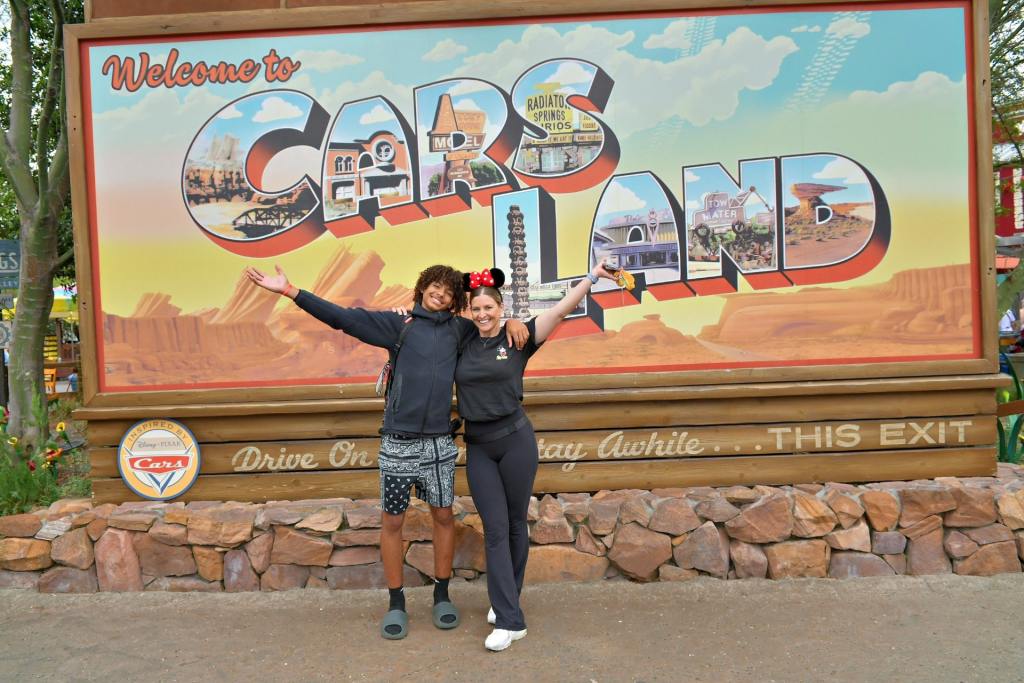 Disneyland. Cars Land California Adventure. Aimee and Jayden at enterence of Cars Land