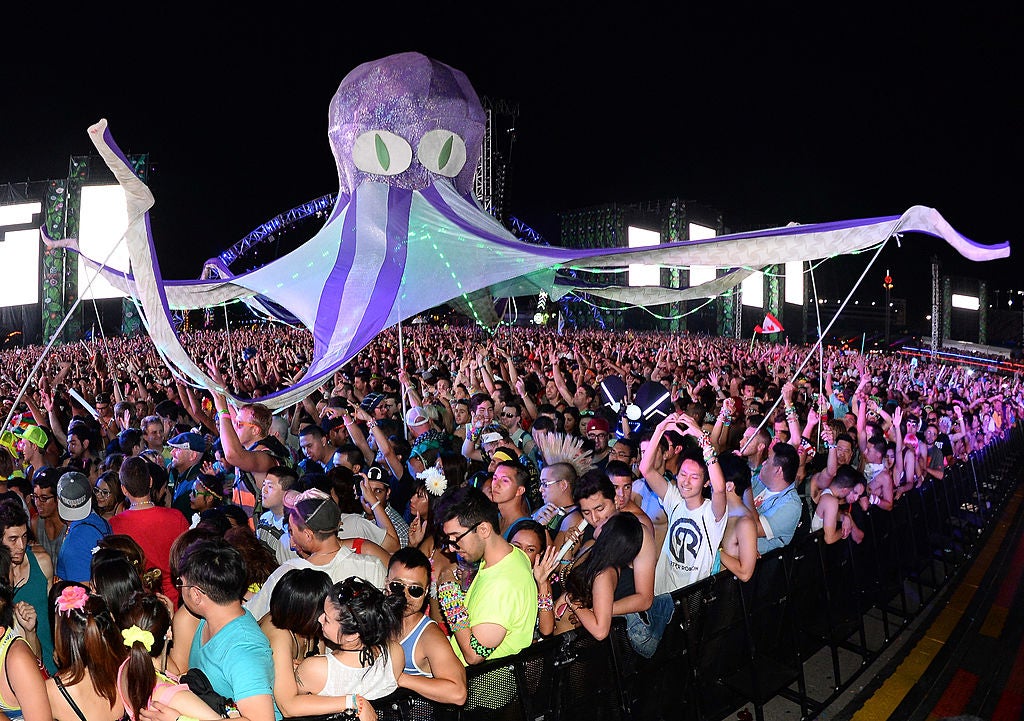 Performers carry an octopus puppet through the crowd at the 17th annual Electric Daisy Carnival at Las Vegas Motor Speedway on June 21, 2013 in Las Vegas, Nevada.