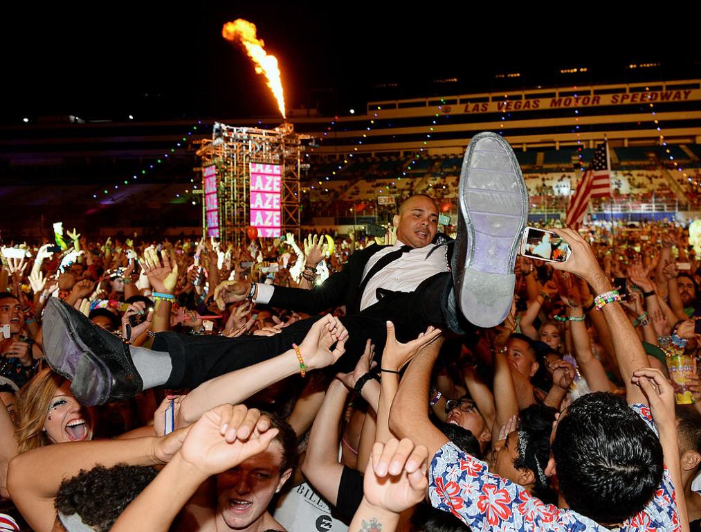 Walshy Fire of Major Lazer surfs the crowd as he performs at the 17th annual Electric Daisy Carnival at Las Vegas Motor Speedway on June 23, 2013 in Las Vegas, Nevada.