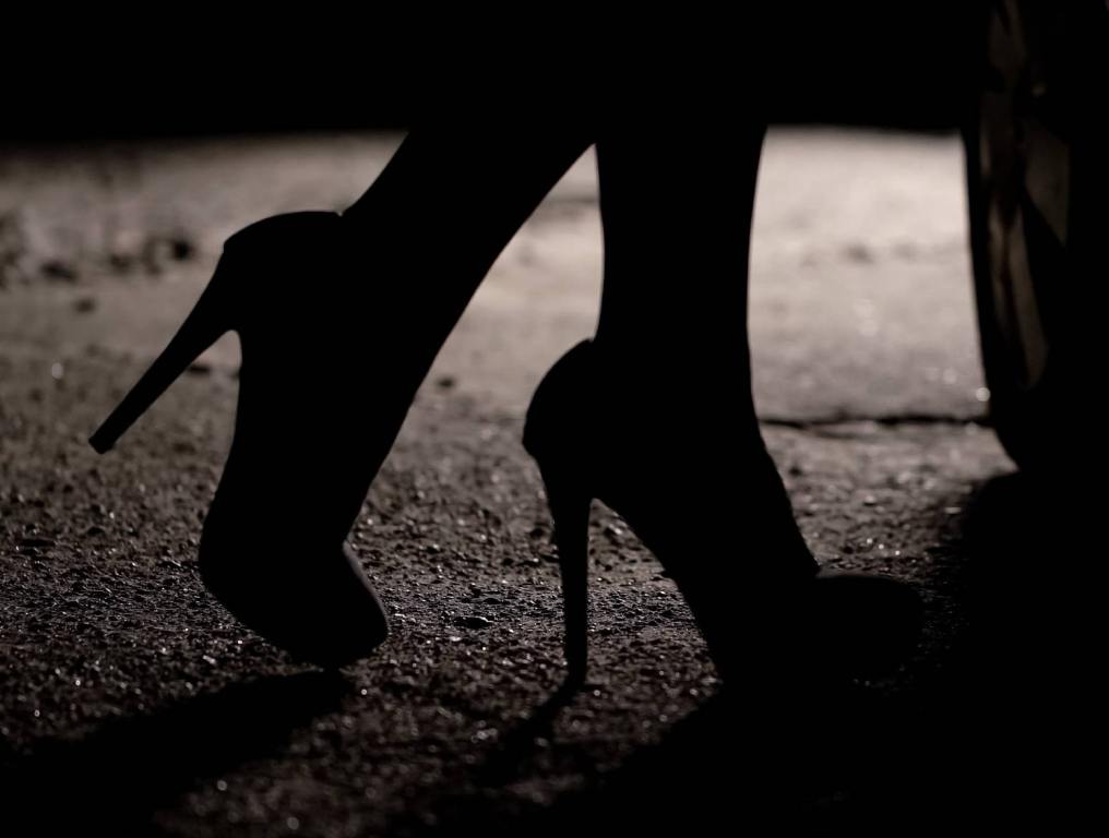 prostitution in las vegas silhouette of high heels on dark city street