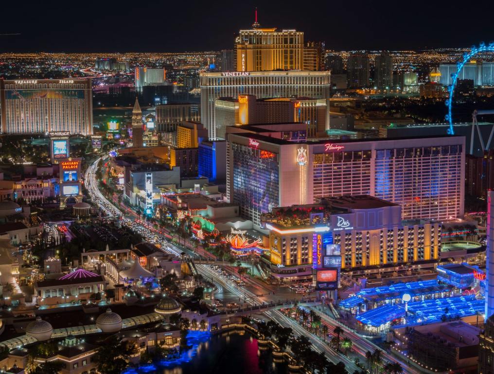 Las Vegas Strip from above featuring hotels like Treasure Island, Flamingo, and more.