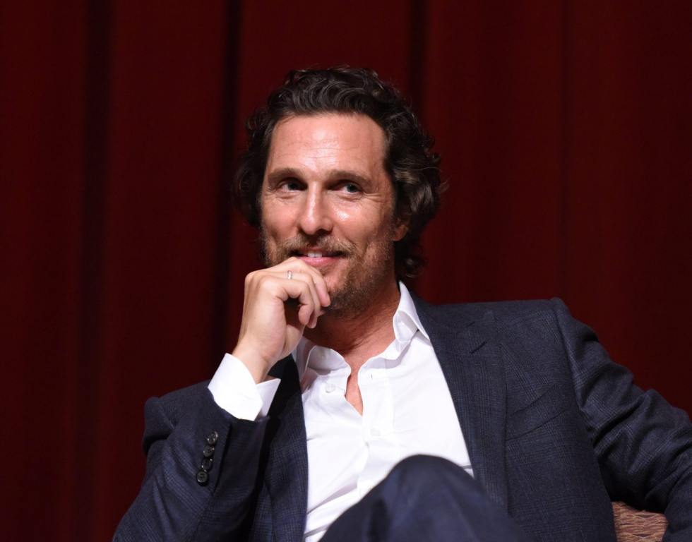 Matthew McConaughey speaks during a Q&A at TWC-Dimension Celebrates The Cast And Filmmakers Of "Gold" sitting wearing a grey suit with white collared undershirt with his hand at his mouth smiling looking right, Matthew McConaughey Quit Acting For 2 Years To Avoid Rom-Coms.