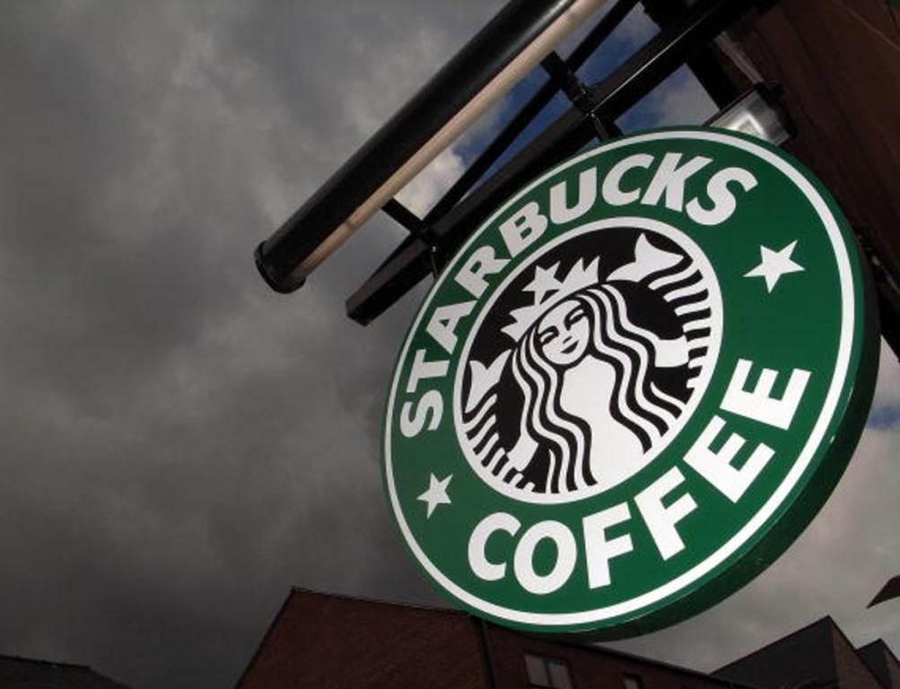 The Starbucks logo hangs outside one of the company's cafes