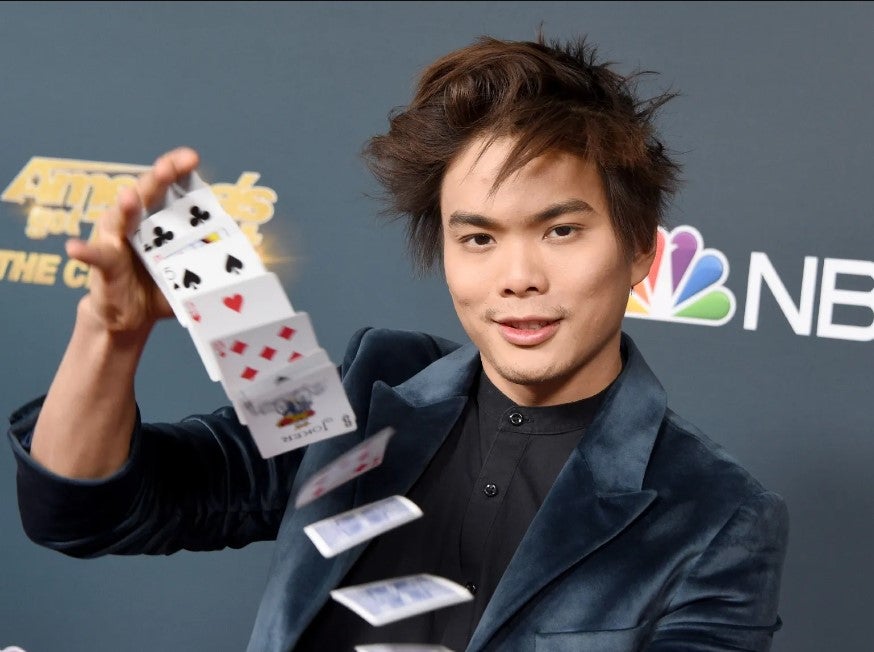 Shin Lim performing magic trick on red carpet