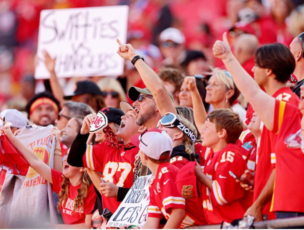 Kansas City Chiefs fans hold signs before the game against the Los Angeles Chargers at GEHA Field at Arrowhead Stadium on October 22, 2023 in Kansas City, Missouri