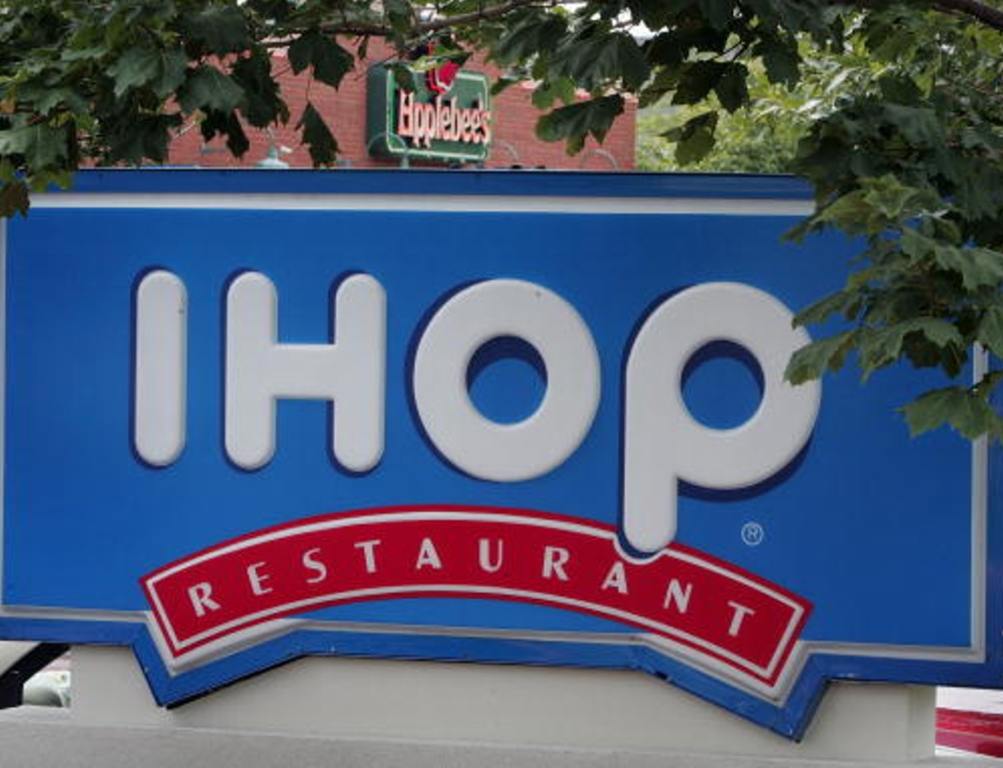 Signs mark the locations of neighboring IHOP and Applebee's restaurants