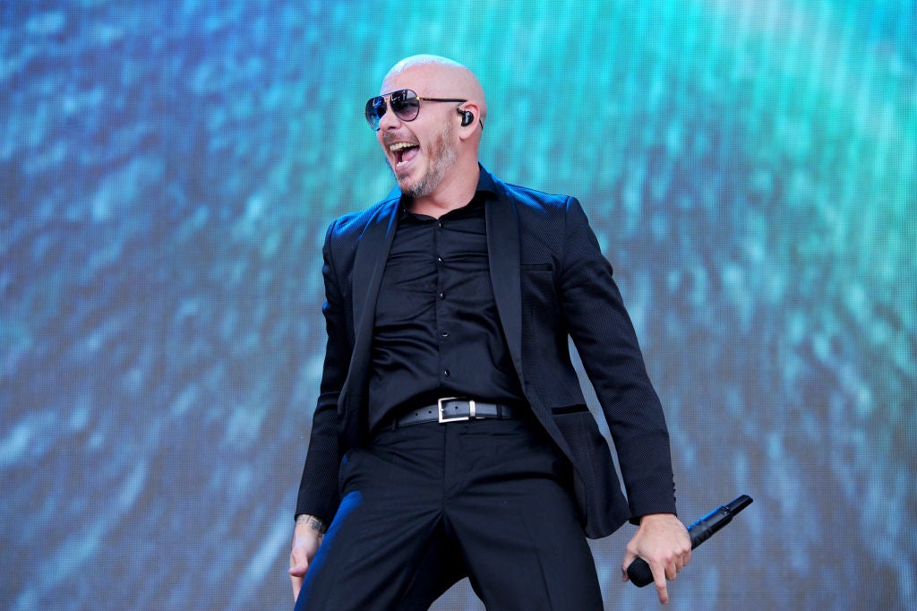 Pitbull on stage performing. Pitbull Makes History Buying Naming Rights For FIU's Football Stadium