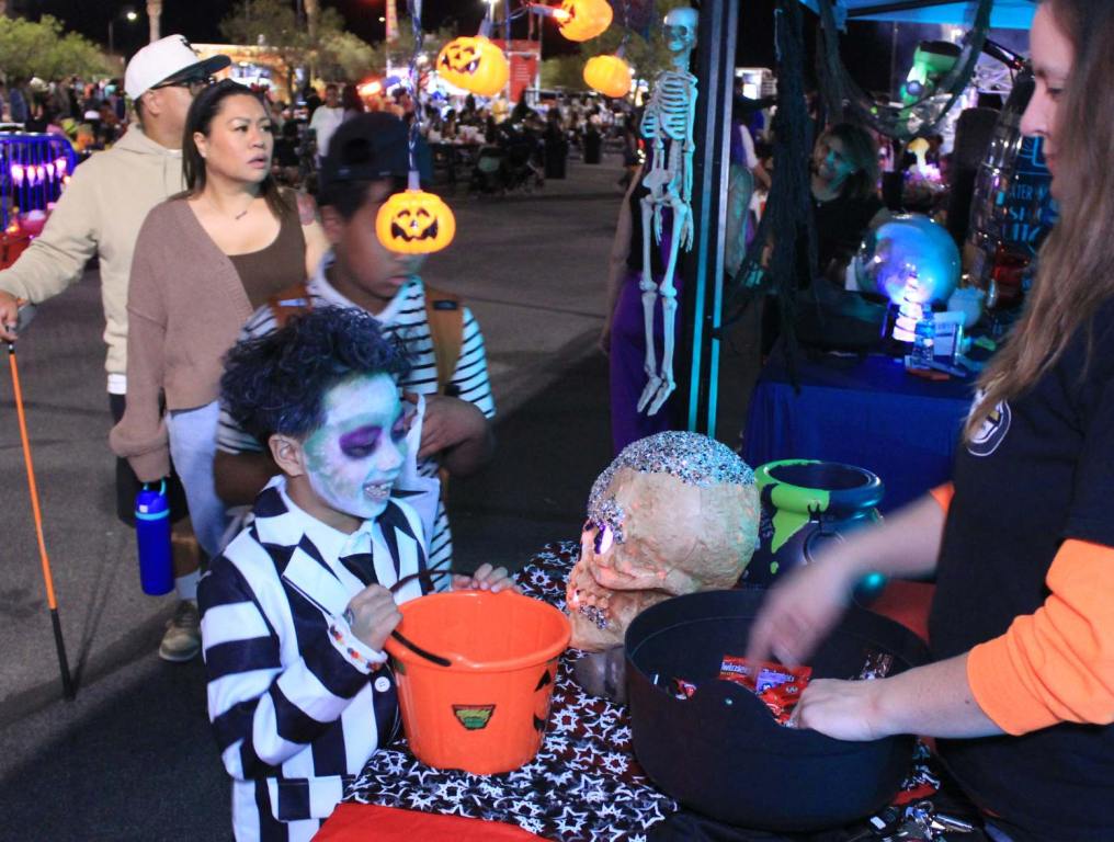 A boy at the table with a Beetlejuice costume