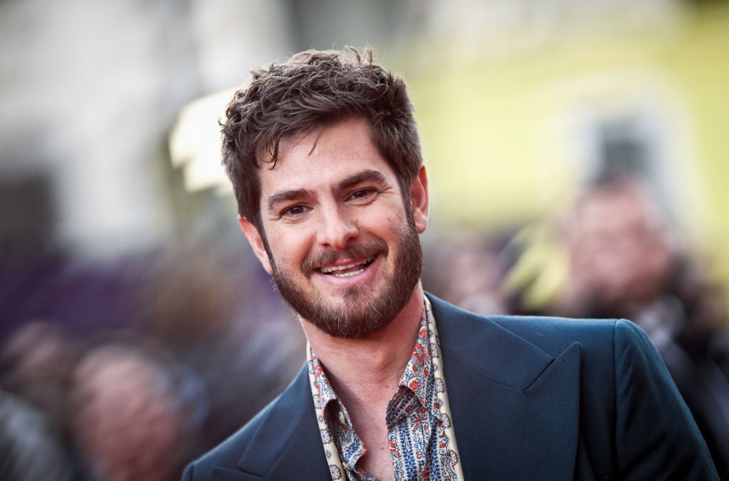 Andrew Garfield - he has a beard and he's smiling