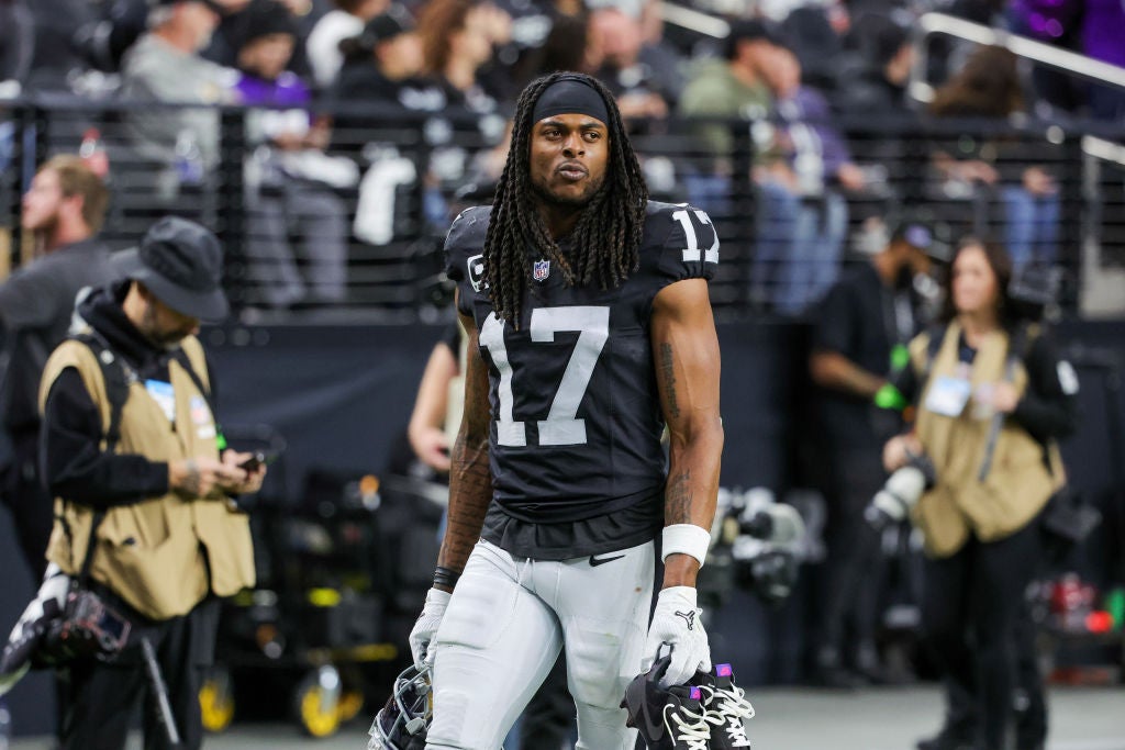 Davante Adams in a Las Vegas Raiders uniform on the sidelines. Las Vegas Raiders Fans Are Not Happy With Farewell Message From Davante Adams