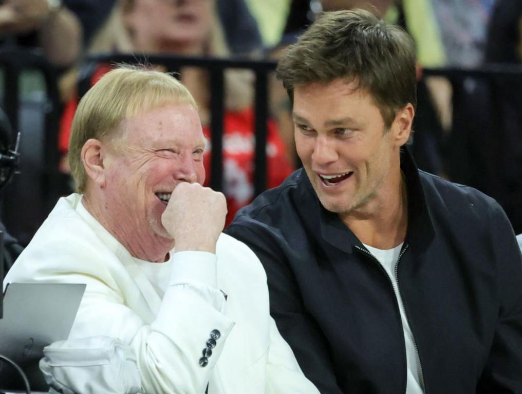 Las Vegas Raiders owner and managing general partner and Las Vegas Aces owner Mark Davis (L) and Tom Brady laugh