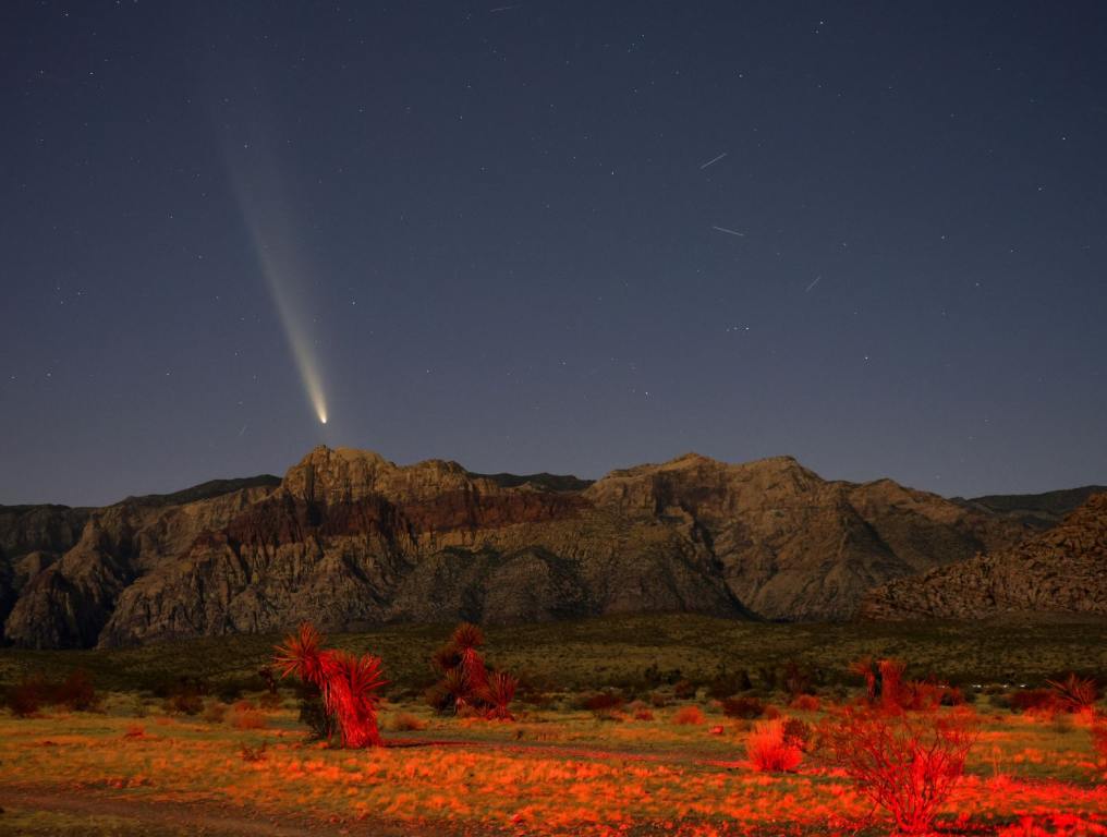 Comet C/2023 A3 (Tsuchinshan-ATLAS) appears in the western sky shortly after sunset above rock formations in the Red Rock Canyon National Conservation Area on October 13, 2024 in Las Vegas, Nevada. The comet, also known as Comet A3, is about 44 million miles from Earth and likely originated from the Oort Cloud. It last passed Earth 80,000 years ago.