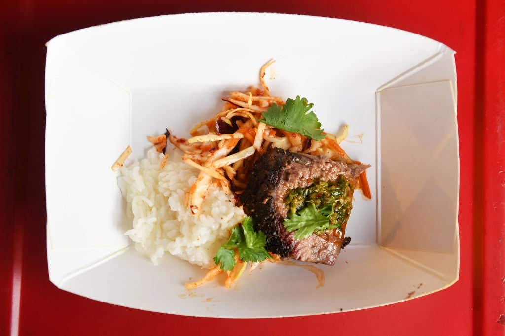 : View of a dish from the Kimchi Smoke booth during the Food Network & Cooking Channel New York City Wine & Food Festival Presented By Capital One - Coca Cola Backyard BBQ Presented By National Beef And Pat LaFrieda Meats Hosted By Bill Durney And Pat LaFrieda at Pier 92 on October 14, 2018 in New York City. (