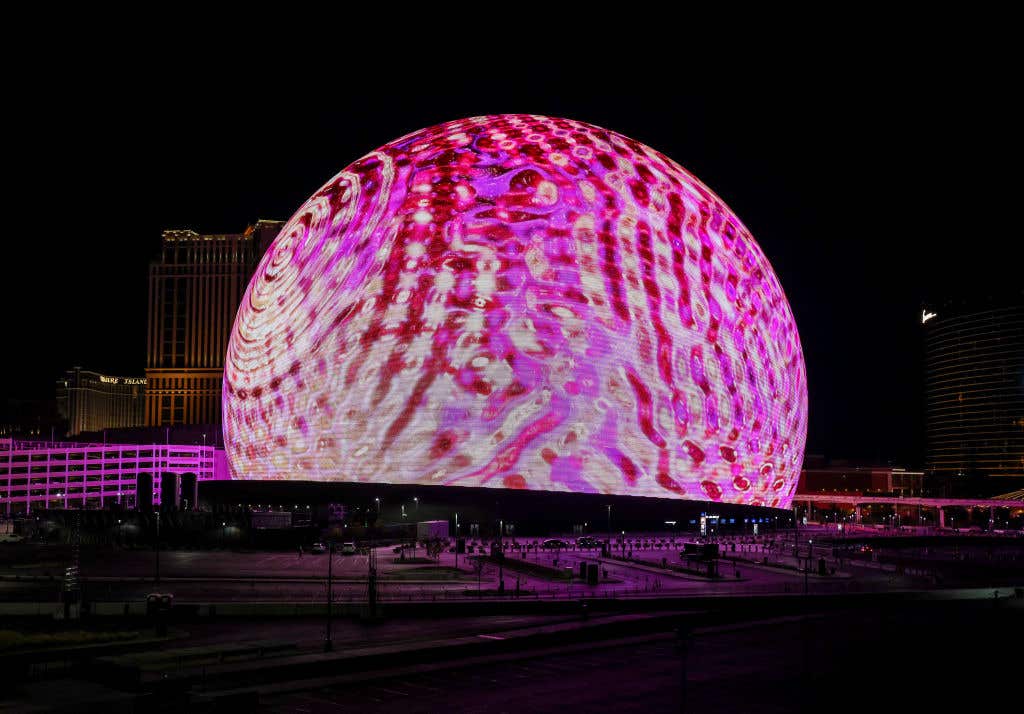 LAS VEGAS, NEVADA - DECEMBER 08: Sphere lights up on December 08, 2024 in Las Vegas, Nevada. The 17,600-seat, 366-foot-tall, 516-foot-wide music and entertainment venue is the largest spherical structure on Earth and features an Exosphere with a 580,000-square-foot display, the largest LED screen in the world.