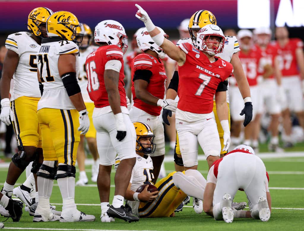 INGLEWOOD, CALIFORNIA - DECEMBER 18: Jackson Woodard #7 of the UNLV Rebels celebrates his tackle of EJ Caminong #18 of the California Golden Bears during a 24-13 win in the Art of Sport LA Bowl Hosted By Gronk at SoFi Stadium on December 18, 2024 in Inglewood, California